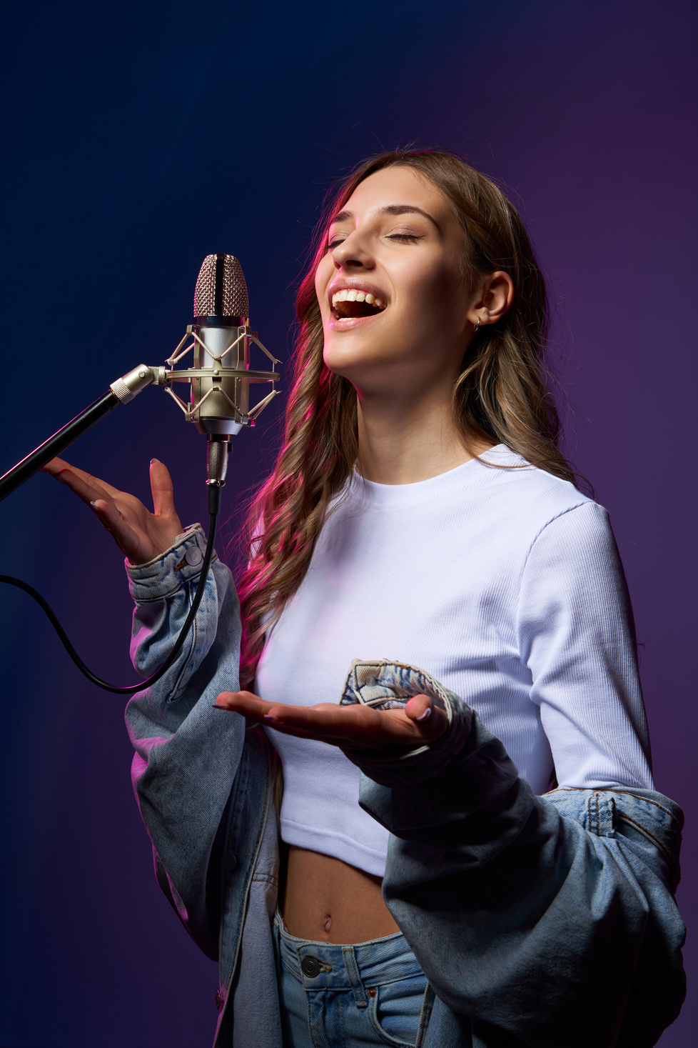 Happy Female Singer with Microphone